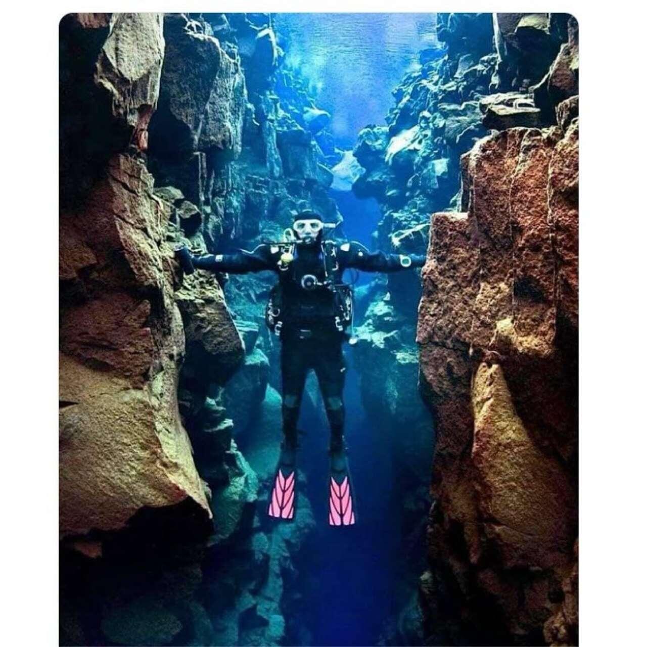 Diver touching 'Two Continents', between North…
