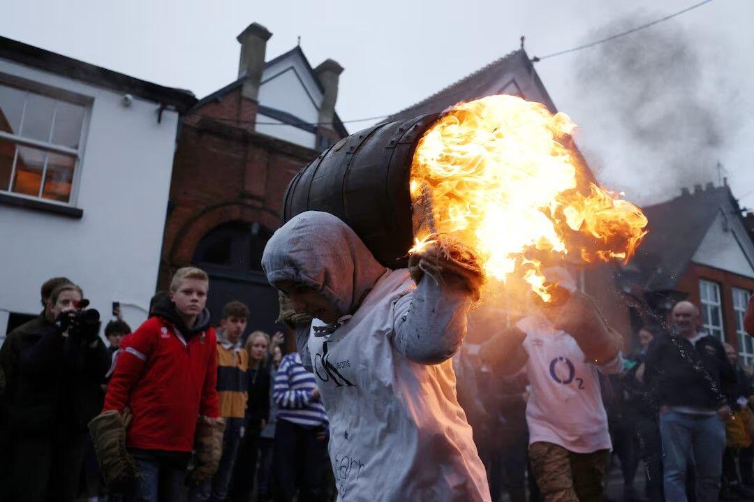 A teenager carrying a flaming tar…