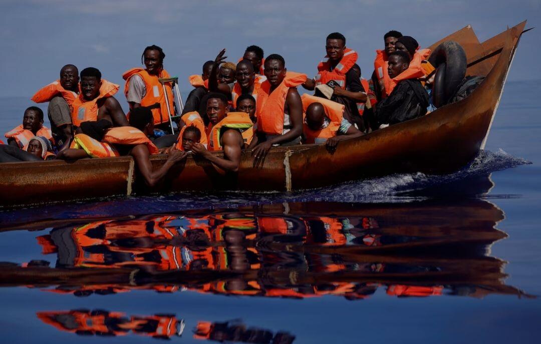 Migrants sail on an iron boat…