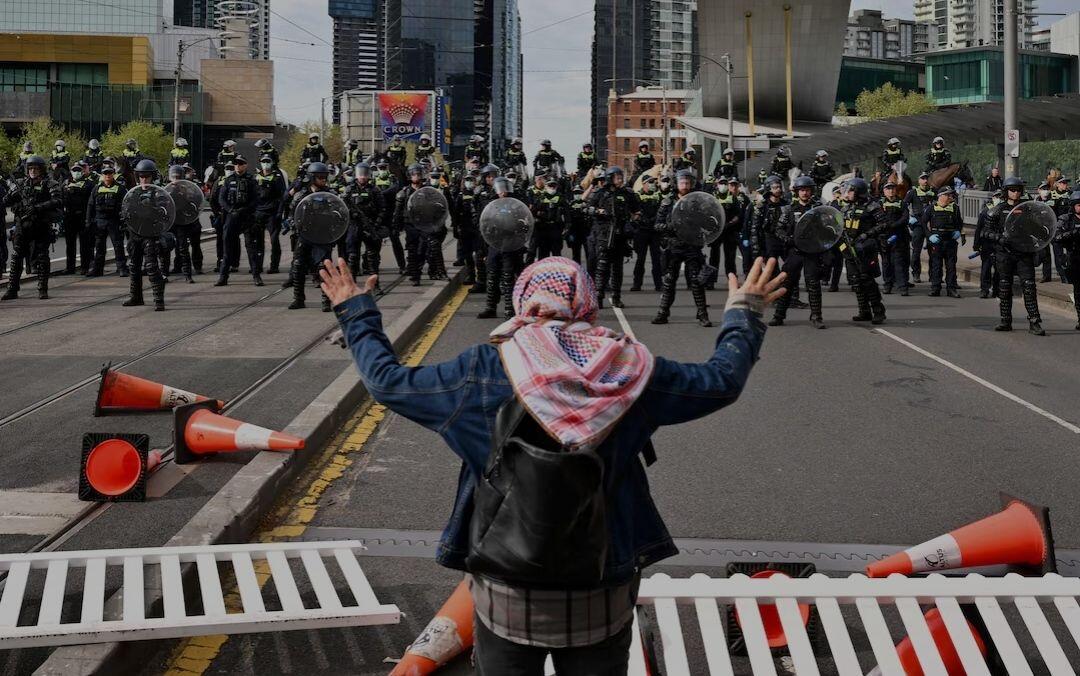 A protester stands during a rally…