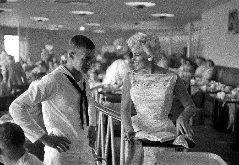 Marilyn Monroe signs an autograph for…