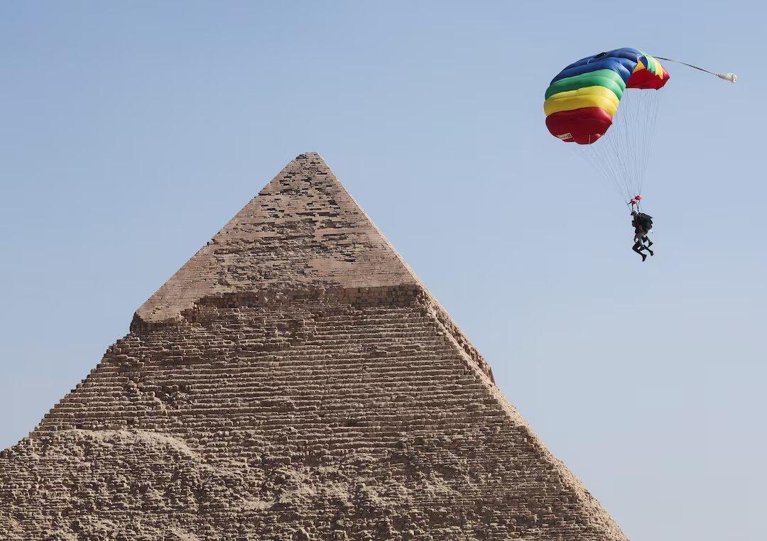 A professional skydiver flies over the…