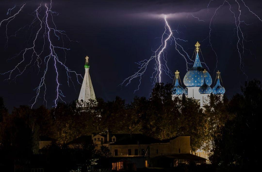 Lightning strikes above the domes of…