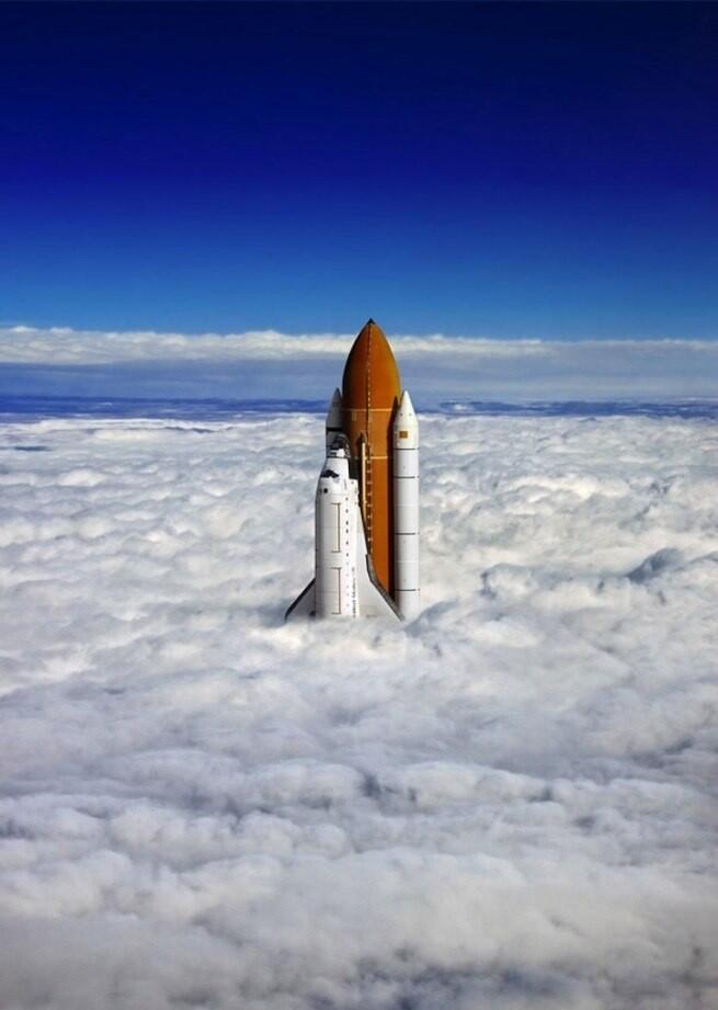 Space Shuttle breaks thrue the clouds