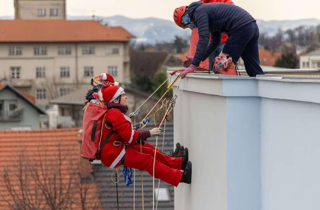 Volunteers dressed in Santa Claus costumes…