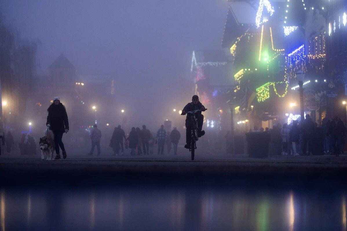 A person pedals a bike past…