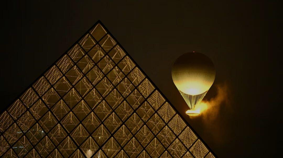 A balloon carrying the Olympic cauldron…