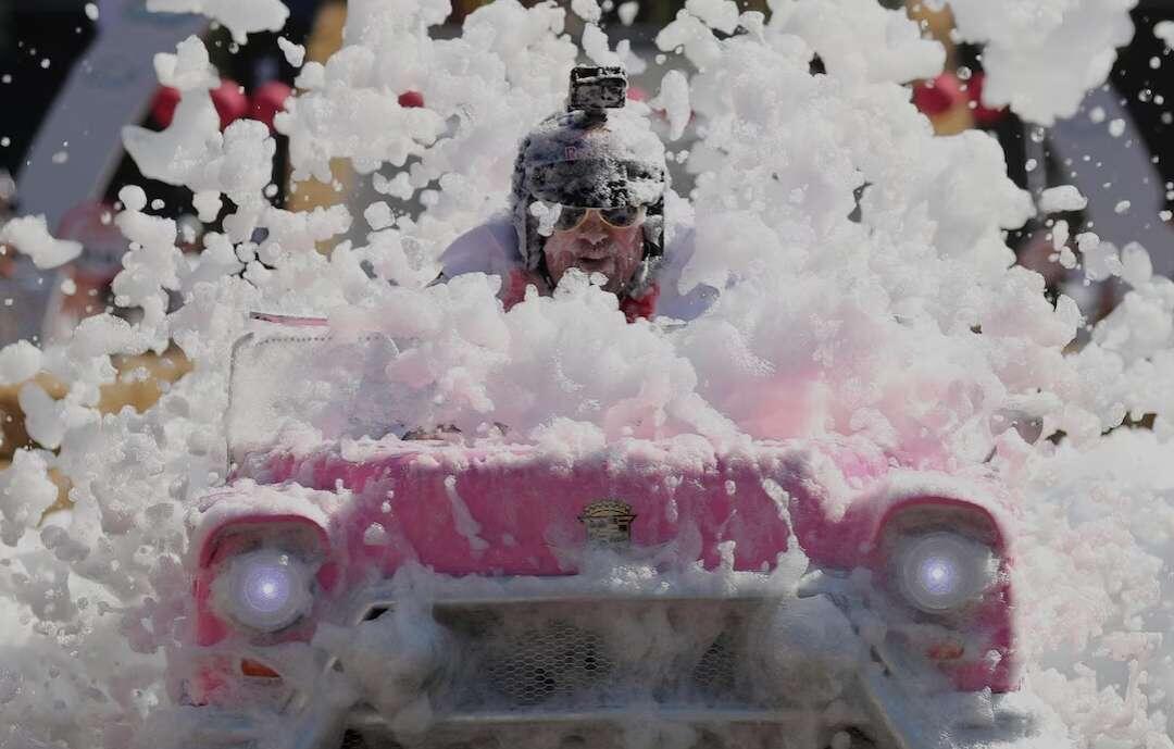 A participant drives his homemade vehicle…