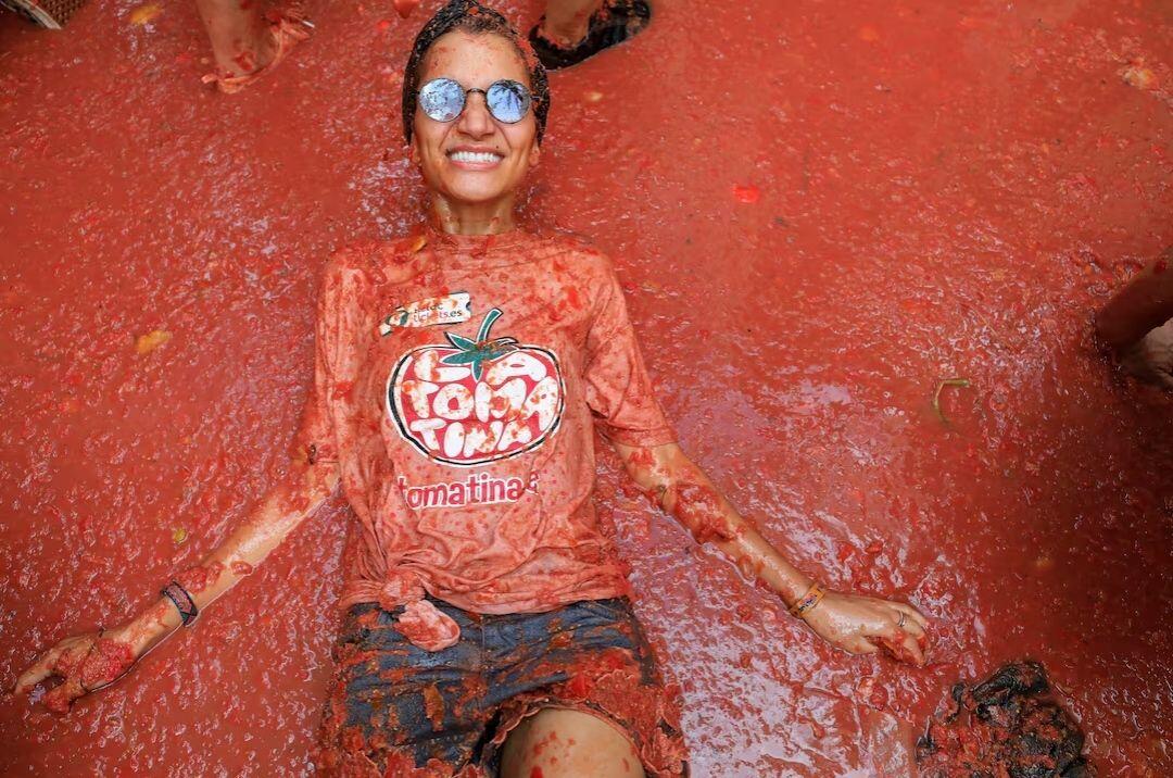 A participant lies in tomato pulp,…